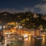 An image of Night view of Portofino, Italy, with illuminated buildings and harbor