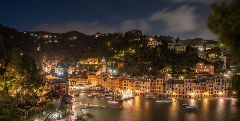 An image of Night view of Portofino, Italy, with illuminated buildings and harbor