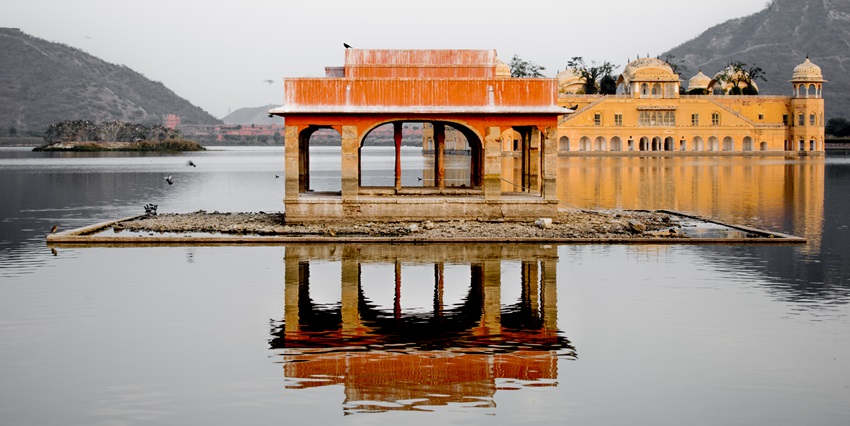 An image of Jal Mahal in Jaipur, India, a historic palace situated in the middle of a lake