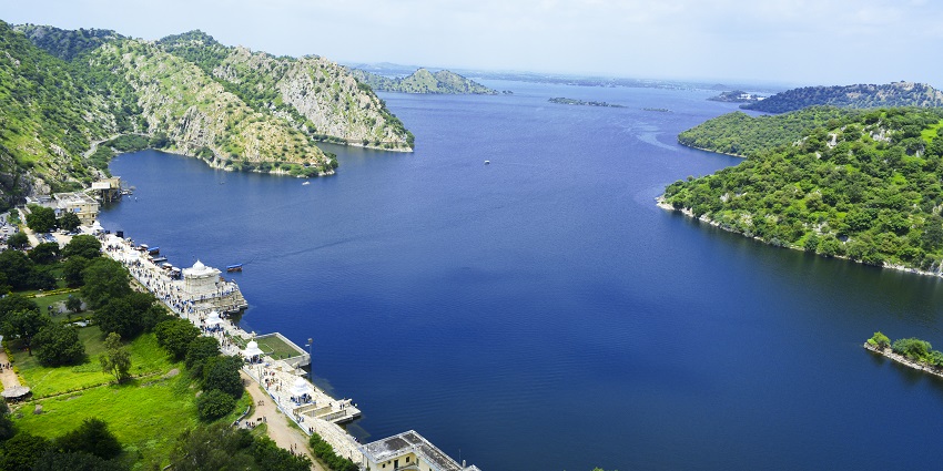 Panoramic view of the second largest artificial lake in India, Jaisamand Lake, with hills surrounding it