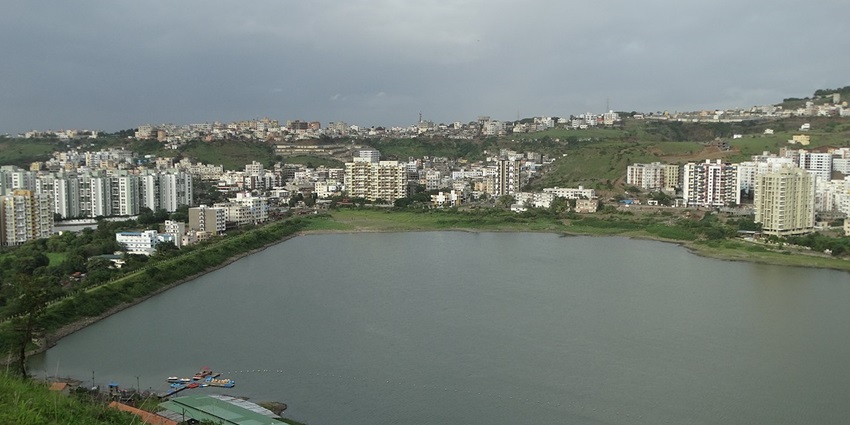 Panoramic view of one of the most visited lakes in Pune and mirror city skyline at dusk