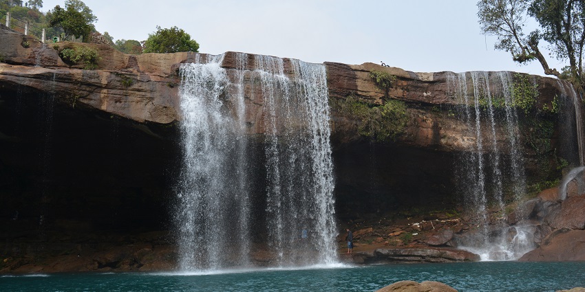 An image showing Khrangsuri Waterfall near Jowai, Meghalaya, with cascading water flows.