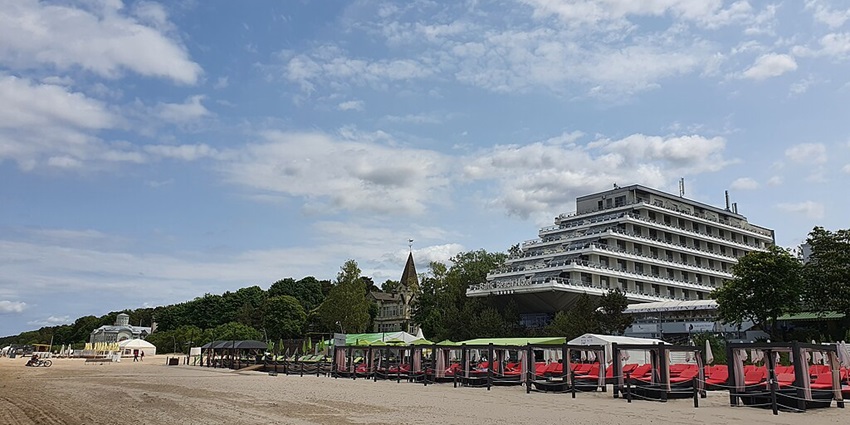 Jūrmala has golden sands, refreshing Baltic waters, scenic dunes, and vibrant seaside atmosphere.