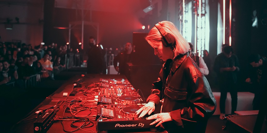 A stylish nightclub with LED-lit dance floors, electrifying DJ sets, and a diverse crowd