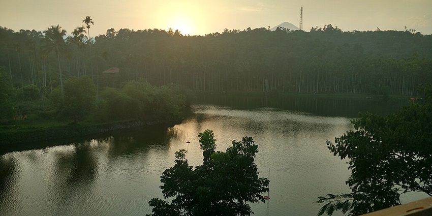 A serene lakeside view at Karlad Lake, a lesser-known lake in Wayanad.