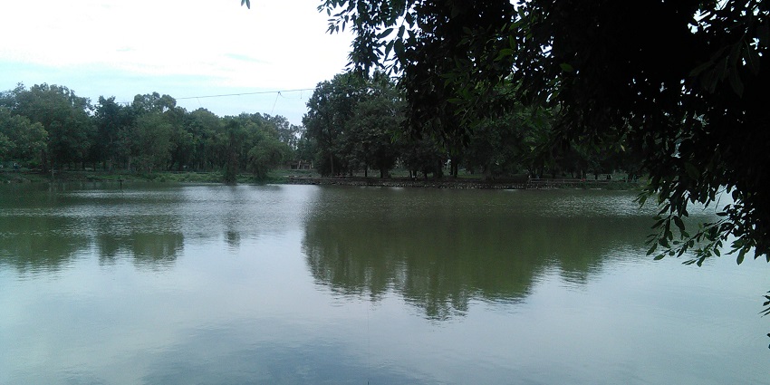 Karna Lake is one of the lakes in Haryana with boats floating on calm waters.
