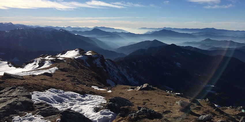 An image of a view from the Kedarkantha peak (Himalayas), a spot for snow trekking in India.