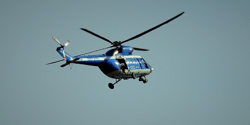 Image of a helicopter - A seamless aerial link to the divine Kedarnath Temple