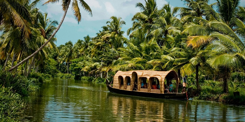 An image of a houseboat in Kerala, one of the best places to visit in March with family.