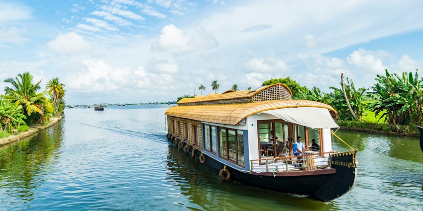 A typical houseboat in the Kerala backwaters near Alleppey, located in Kerala, India.