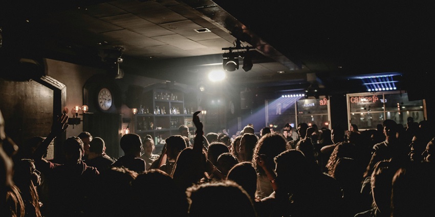 image of the electrifying bar where people are dancing on the beat