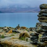 Image of Pangong Tso Lake gray rocks stacks on brown surface near the Khurnak Fort