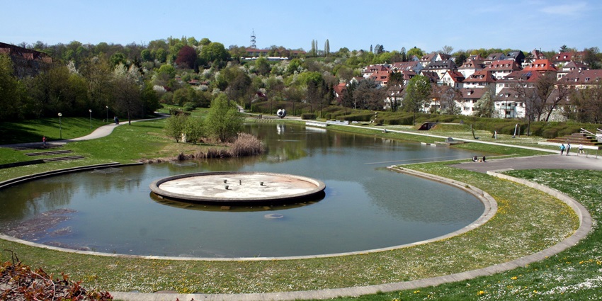 A serene view of the Killesberg Park and Tower featuring lush green manicured lawns.