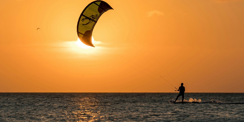 A beautiful view of the sea while kitesurfing during sunset