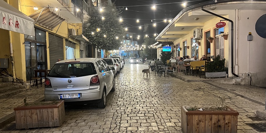 An outdooring seating and vibrant lighting at one of the cosy cafes in Kruje, Albania.