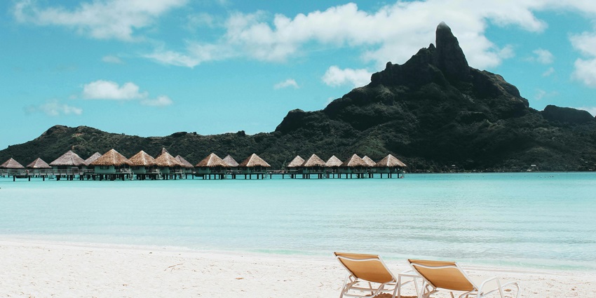 Serene island vibes at the beaches in Valencia with cottages, chairs & endless blue!