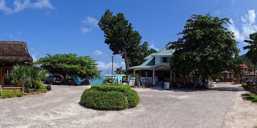 Tranquil coastal village featuring the ferry terminal and lush greenery of La Passe.