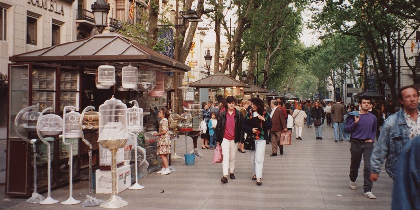 A couple touring La Rambla, a famous street to visit.