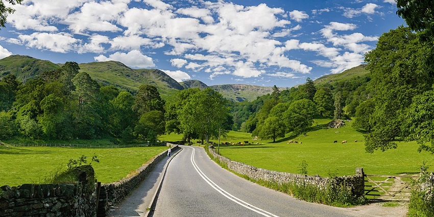 The lake district is among the best places to visit in England in July featuring the stunning national park with serene lakes and rolling hills.