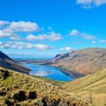 An image of Scenic Lake District National Park with lakes, hills, and charming villages