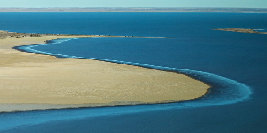 An image of Lake Eyre, one of the largest salt lakes in Australia, with stunning reflections