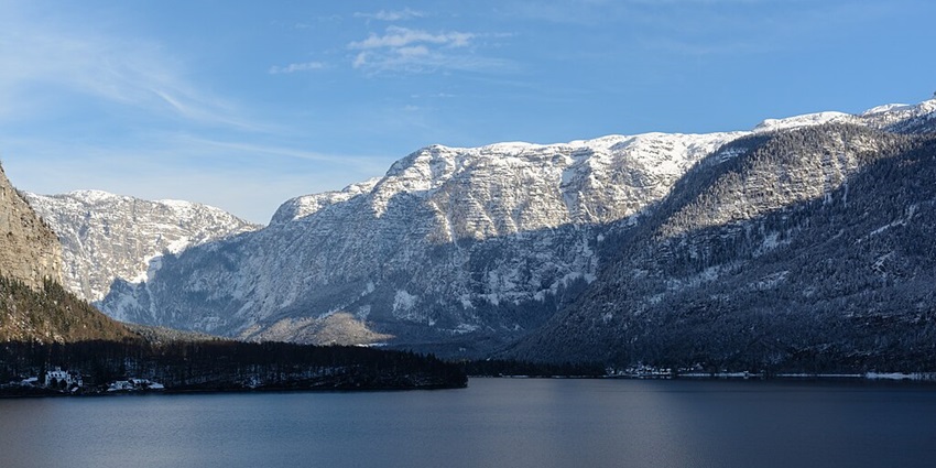 An image of Lake Hallstatt, Austria, one of the picturesque lakes in Europe, surrounded by snow.