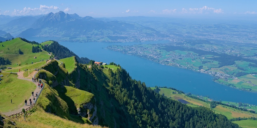 An image view of Lucerne Lake in Switzerland with calm waters, Mount Pilatus, and a scenic panorama
