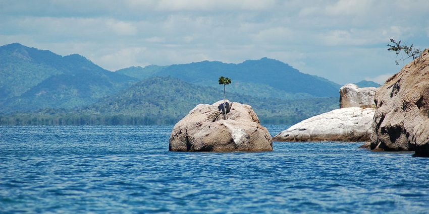 An image of the canoes and tourists on Lake Malawi, one of the deepest lakes in the world