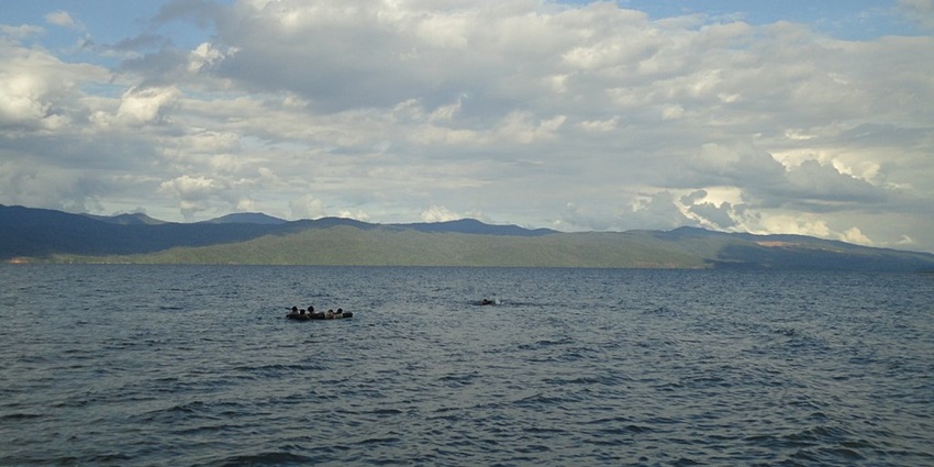 An image of the tranquil and deep waters of Lake Matano in Indonesia, one of the deepest lakes in the world