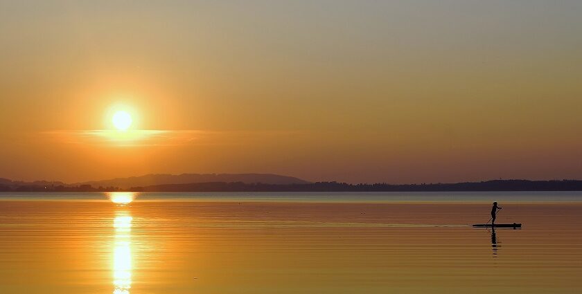 An image of Chiemsee, an eye pleasing lake in Germany in the evening at the of sunset