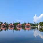 One of the lakes in Kerala, surrounded by lush greenery, perfect for a peaceful retreat.