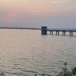 Beni Sagar Dam in Madhya Pradesh with a structure in the lake connected by a blue bridge