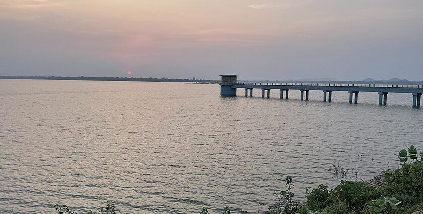 Beni Sagar Dam in Madhya Pradesh with a structure in the lake connected by a blue bridge