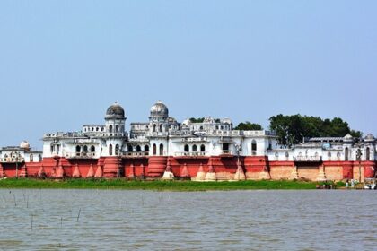 Lake in Tripura with a bright red and white neer mahal with its unique architecture