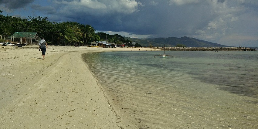 Peaceful getaway with powdery sand and gentle sea waves.