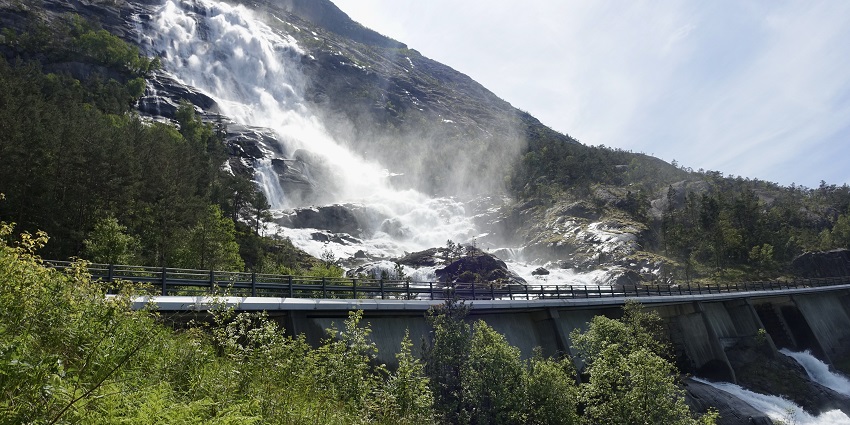 An image of Langfossen Waterfall cascading down cliffs, a magnificent Norway waterfall location.