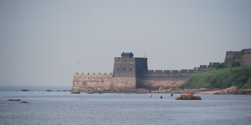 An image of the Laolongtou Great Wall with a section of the Wall extending into the sea