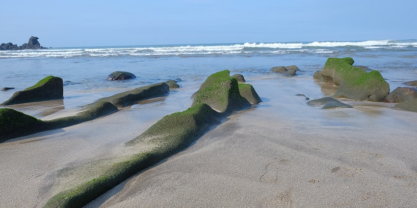 One of the Taiwan beaches, known for green algae-covered rocks and scenic views.