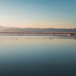 Bright sunset at the Sambhar Lake with the sun reflecting on the large saltwater body