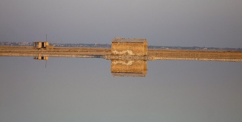 Bright sunset at the Sambhar Lake with the sun reflecting on the large saltwater body