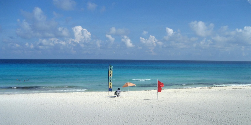 A calm beach, ideal for families, with shallow waters perfect for young children.