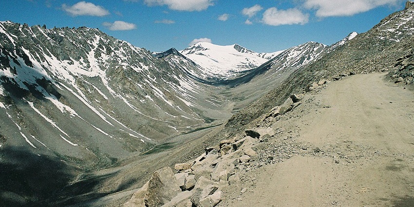 An image of the Leh-Ladakh area covered in snow and low hills, one of the famous destinations in North India.