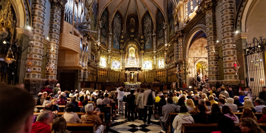 Tourists listening to the choir at Montserrat Monastery
