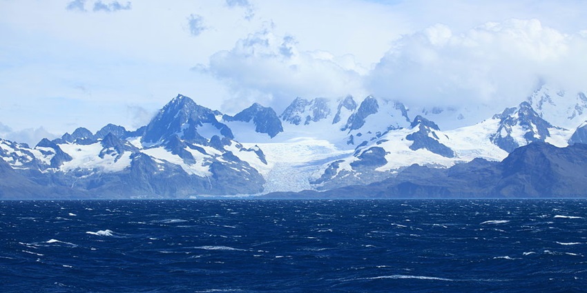 Remote South Georgia Island featuring glaciers, mountains, and abundant marine wildlife