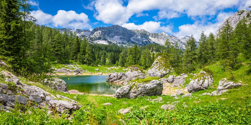 A beautiful view of the Triglav mountains and the lake during the hike Triglav Seven Lakes