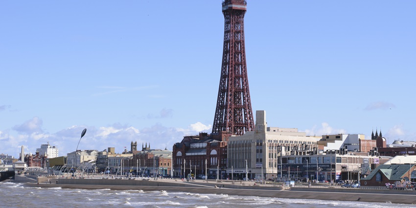 An image of Blackpool tower from Lake District National Park under a clear blue sky