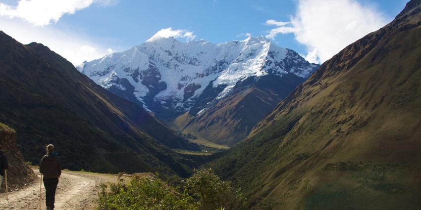 Breathtaking view of Salkantay Mountain with rugged slopes and a bright blue sky on the Salkantay trekking trail.