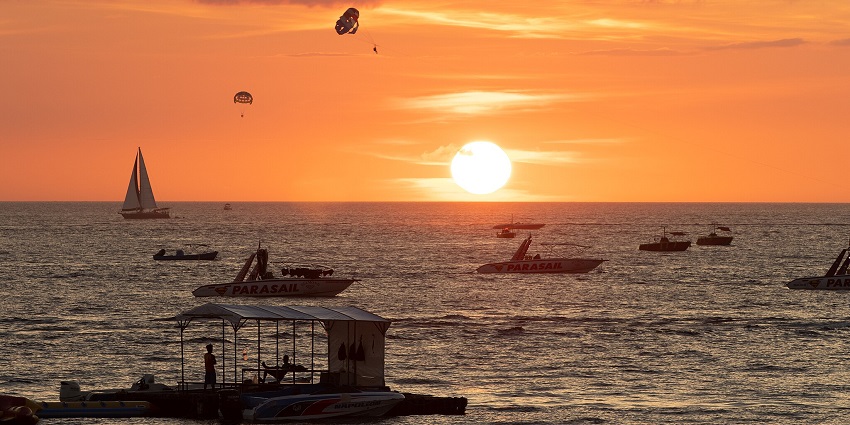 Boracay island is famous for its white-sand beaches, sunset, outdoor sports activities, food, and night-life