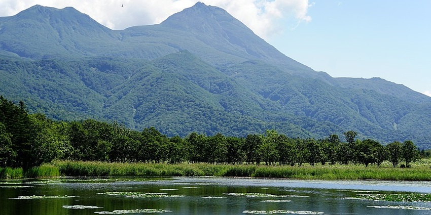 Shiretoko National Park features rugged landscapes, lakes, dense forests, and wildlife.