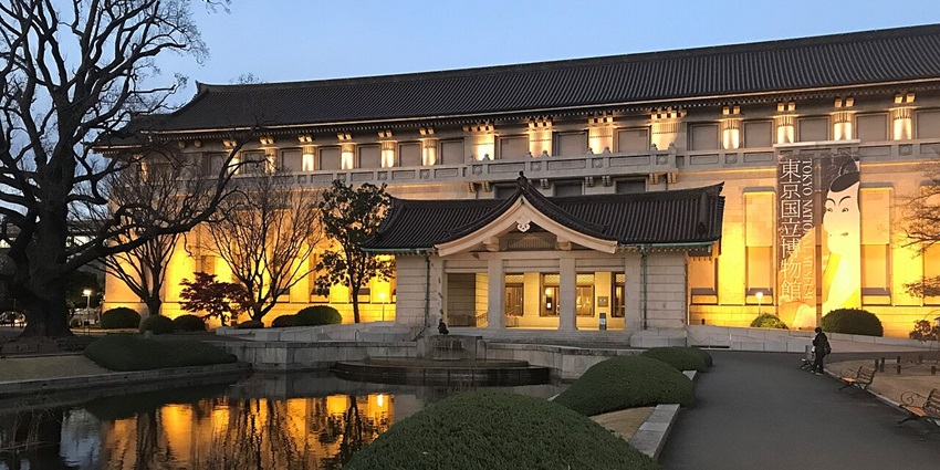 The entrance of Tokyo National Museum illuminated during the evening hours